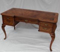 A 20th century walnut desk,