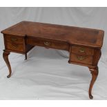 A 20th century walnut desk,