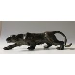 A 20th century Bronze model of a stalking Panther,