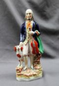 A 19th century pottery figure of the "The Blind Fiddler", with a dog at his heels, 29.