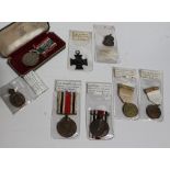 A British medal group comprising Special constabulary faithful service medals awarded to Henry
