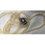 A three strand pearl necklet, of one hundred and three,