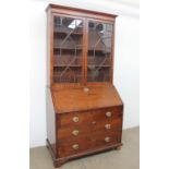 A George III mahogany bureau bookcase,