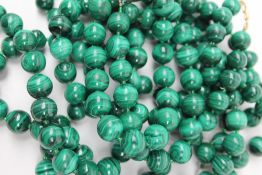 Two malachite bead necklaces and a matching bracelet