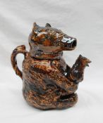An early 19th century and later treacle glazed bear jug,