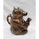 An early 19th century and later treacle glazed bear jug,