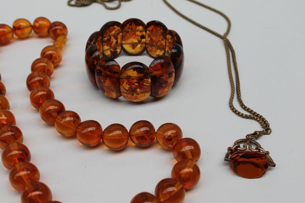 An amber bead necklace with spherical beads together with an expanding bracelet a rotating fob seal - Image 2 of 7