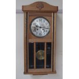 A 20th century oak wall clock