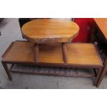A low rectangular teak coffee table together with an occasional table