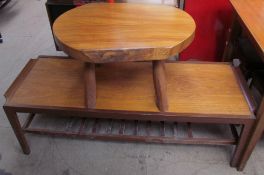 A low rectangular teak coffee table together with an occasional table