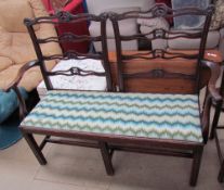 A George III style double chair back settee,