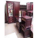 A modern wardrobe with mirrored doors and drawers together with a dressing chest,