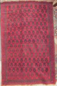 A red ground rug with geometric pattern,