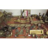 A brass fire fender together with brass figures, brass coal box, brass picture frame,