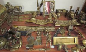 A brass fire fender together with brass figures, brass coal box, brass picture frame,