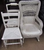 A wicker rocking chair together with two white painted bedroom chairs