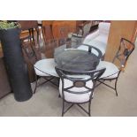 A metal and tiled dining table and four chairs together with a black painted terracotta pipe