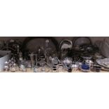 A large quantity of electroplated wares including part tea sets, trays, sectional dishes, cruets,