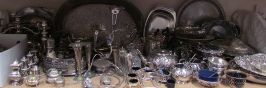 A large quantity of electroplated wares including part tea sets, trays, sectional dishes, cruets,