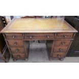 A 20th century oak pedestal desk,