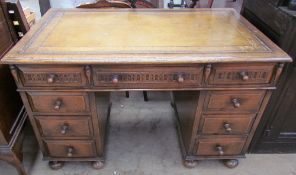 A 20th century oak pedestal desk,