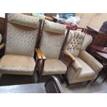 A wing back upholstered arm chair together with a pair of upholstered chairs