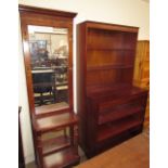 A 20th century hall stand with a central rectangular mirror, brass hooks,