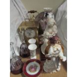 An Hermie anniversary clock together with a brass lidded vase, glass bells,