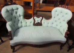 A Victorian rosewood upholstered double chair back settee