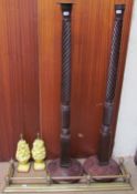 Two mahogany bed posts together with a brass fender and two table lamps