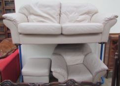 A leather upholstered three seater settee together with an arm chair and a foot stool