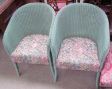 A pair of Lloyd Loom Lusty products elbow chairs