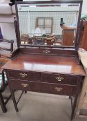 A 20th century mahogany dressing table,