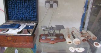 A Victorian walnut sewing box, with fittings together with a letter scales,