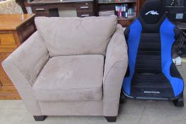 An upholstered arm chair together with an AK Rocker chair