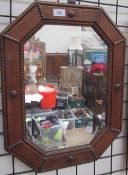 An oak framed wall mirror together with a large quantity of pictures