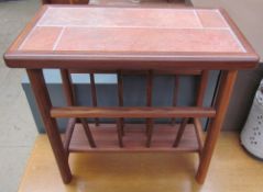 A mid 20th century tiled top teak magazine rack