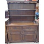 A 20th century oak dresser with a planked back,