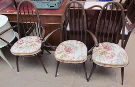 A pair of Ercol elbow chairs,