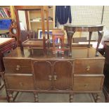 A 20th century oak sideboard together with an oak occasional table,