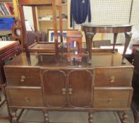 A 20th century oak sideboard together with an oak occasional table,