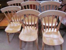 A pine refectory table together with a set of six pine dining chairs