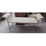A rattan and wrought iron bench