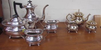 An electroplate part tea and coffee service together with another part coffee service