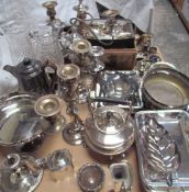 A large collection of electroplated wares including entree dishes and covers, candelabras,