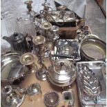 A large collection of electroplated wares including entree dishes and covers, candelabras,
