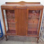 A 20th century walnut display cabinet