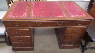 A reproduction mahogany pedestal desk,