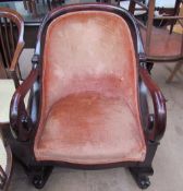 A Victorian mahogany library chair converted to a rocking chair,