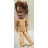 A Simon & Halbig 1078, bisque head doll, with closing blue eyes, open mouth and teeth,